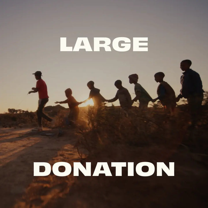 Silhouette of people holding hands with a large donation text overlay