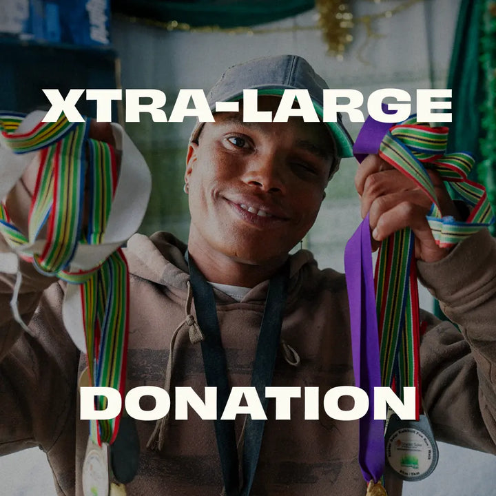 Person holding colorful ribbons with text 'XTRA-LARGE DONATION' overlayed
